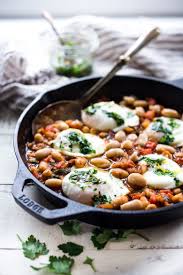 Simple Tuscan Farmers Breakfast Eggs Gently Simmered In A Tomato Cannelini Bean Stew Keep It Vegetarian Or Asian Breakfast Italian Breakfast Italian Recipes