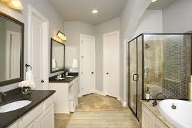 Gehan Homes Black Granite Countertops White Wood Cabinets Tan Tile Drop In Tub Gray Walls San Antonio Tex Tan Bathroom Black Bathroom Bathrooms Remodel