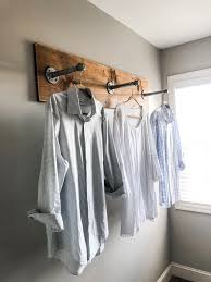 I knew i could do it cut your dowel rods to fit inside your drying rack frame. Diy Clothing Rack For Your Laundry Room With Industrial Pipes And Wood Wilshire Collections