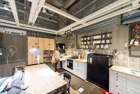 woman choosing modern kitchen furniture