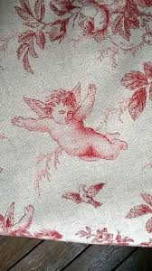 Toile de jouy was a specific type of linen printed with romantic, pastoral patterns in a single color—usually black, blue, or red—on an unbleached fabric. French Toile De Jouy Red Angels Printed Pattern Cotton And Linen Unbleached Fabric Background Red Print 280 Cm Wide Angel Print Toile De Jouy Print Patterns