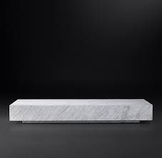 Woodblock designed coffee table on a low pedestal provides a convenient place for magazines, needlework or remotes. Low Marble Plinth Coffee Table