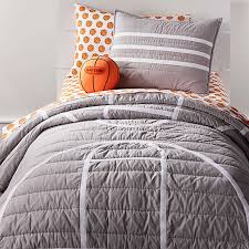The oversized quilt reverses to white paisley pattern on an orange saffron background. Grey Cotton Quilts Crate And Barrel