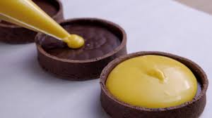 Tartelette With Chocolate Ganache And Mango Passionfruit Cremeux In 2020 Mini Desserts Mango Chocolate Chocolate Ganache