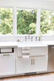 The cabinet height above a range is typically the same height. My Kitchen Remodel Reveal Driven By Decor