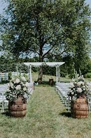Outdoor Arbor Garland And Floral Amazing Floral Moments Outdoorweddingphotography Wedding Aisle Outdoor Backyard Wedding Ceremony Wedding Aisle Decorations