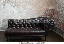 If you're in the market for a vintage sofa, then you know how the term couch surfing can take on a whole new meaning—and not necessarily a relaxing one. Leather Sofa In The English Style In The Room With Old Brick Walls Leather Sofa In The English Style In The Room With Old Canstock