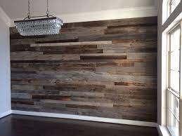 Accent walls can actually really change the vibe in your home, and it will definitely be for the better. Close Up Of The Dining Room Reclaimed Wood Accent Wall Before The Furniture Was Moved Back In Reclaimed Wood Accent Wall Wood Accent Wall Reclaimed Wood Wall