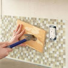 Diy Kitchen Backsplash Seat Tiles Firmly In The Mastic By Tapping A Board Diy Kitchen Backsplash Kitchen Backsplash Home Diy