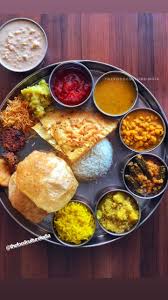 I Ate Had Indian Thali With Rice Lentils Puri Sabji Some Fritters Papad Chutney And Also Traditional Indian Food Indian Food Photography Indian Food Recipes