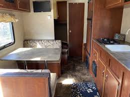 The kitchen has a double bowl undermount sink, a 3 burner stovetop with an oven. 2017 Salem Cruise Lite Free Rv Classifieds Used Rvs Rv Classes Motorhomes Travel Trailers 5th Wheel Rvs For Sale