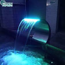 Staggered cascade waterfalls at the pool edge offer a stepstone variation for visual interest. China Spa Equipment Massage Swimming Pool Waterfall Water Curtain China Pool Waterfall And Pool Spa Price