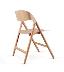 The Folding Chair Gets A Modern Update Wooden Folding Chairs Folding Chair Wood Chair Design