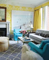 In this living room, aqua accents in the pillows, throw, and rug mimic the ocean's dazzling blues, and the pops of bright orange are inspired by the magnificent hues of the setting sun. 25 Colorful Living Room Design Ideas