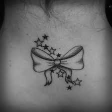 Seductive, beautiful bow tie temporary tattoo, looks sizzling hot on the back of the thighs! Black Bow With Tiny Stars Tattoo Design By Niels