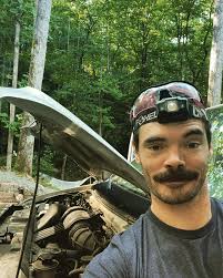 Getting fired up for our west coast tour. Replaced the van's spark plugs,  which, judging from the old ones, was a good call. Cranked 'er up and she's  purring like a lion.