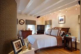 When planning bedroom lighting design, consider the space's natural lighting first, and then determine which parts of the room benefit most from most bedrooms come equipped with overhead lighting. Gorgeous Track Lighting Ideas For The Contemporary Home Track Lighting Bedroom Bedroom Interior Brick Interior