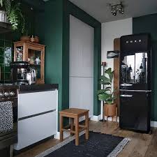 The Dark Green Walls Makes The White Kitchen Units Pop In This Kitchen Love The Black Smeg Fridge K With Images White Kitchen Units Dark Green Walls Green Kitchen Walls