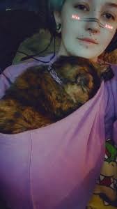 Sadie girl breaking in her new rocker recliner loveseat...rub my  belly...lol