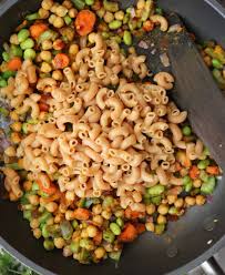 Rotini with curried cauliflower béchamel & breadcrumb topping. Easy Vegan Creamy Curry Pasta Recipe Savory Spin