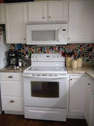 By just changing your cabinets, you'll give your countertops, appliances and even your accessories a. White Appliances White Cabinets Home Decor And Interior Design