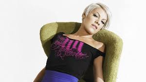 Photo of P!nk sitting on brown sofa chair HD wallpaper | Wallpaper Flare