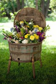 Garden Decoration Ideas How To Insert A Country Touch In Your Garden In 2020 Wine Barrel Planter Rustic Gardens Diy Garden Decor