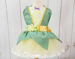 This shimmering ariel costume is detailed with fanciful undersea foliage, sequins, and tiers of tulle, all topped by a silvery shell brooch encrusted in treasures untold. Tiana Baby Costume Etsy