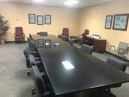 Modern empty meeting room with big conference table with various documents and laptops on it, on the wall big tv showing company's growth, statistics and pie charts. Apple Tv In Conference Room Challenge Macrumors Forums