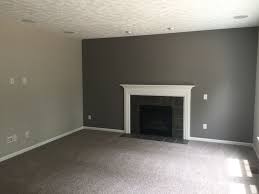 The color combination in grey and teal living room provides you a delightful look that will make the area perfect for gathering. Our Carpet Is Mohawk Brand In Rainswept Gray The Dark Gray Accent Wall Is Done In Sh Accent Walls In Living Room Grey Accent Wall Living Room Grey Accent Wall
