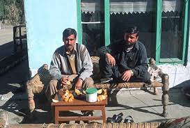 Image result for MAN SITTING ON A CHARPOY AND HAVING A CUP OF TEA