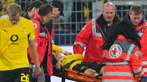 Borussia Dortmund Shaken as 'Trage, Trage' Echoes: 19-Year-Old Greek Star Karetsas stretchered off in Goalless Champions League Opener