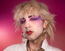 Getting Glitzed with the Gays: Biodegradable centered startup launches  holographic product line tomorrow at Darling's Bar