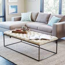 Navy velvet totally tufted round ottoman coffee table gold base rich in tactile luxury and glam d. 50 Best Coffee Tables 2019 The Strategist