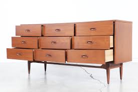 A duo tone dresser with both style and function in mind. Mid Century Walnut Dresser By Dixie Furniture Vintage Supply Store