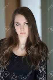 I have brown hair and blue eyes. Photo Of A Very Attractive Woman With Brown Hair And Blue Eyes Shot In A Doorway She Is Wearing A Sexy Black Lace Shirt And Has A Pouty Facial Expression Stock Photo
