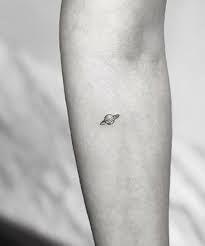 Tiny Planet Tattoo In 2021 Planet Tattoos Tattoos Tiny Tattoos For Girls
