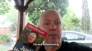 Letterboxing my final flyer in the rain