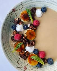 Chef @joe_beninato made some changes to our brunch menu today! Pictured  first is “cereal” made with oat milk panna cotta, bananas, fresh fruit, and  candied nuts. Second is pastrami style short rib