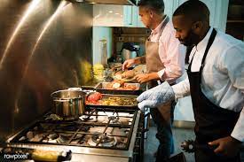 Fries and a hamburger, donuts, soup, spaghetti with meatballs, sushi, pizza, sorbet, cake, cocktails and many more! Download Premium Image Of Two Men Cooking In A Kitchen 260192 Man Cooking Cooking Kitchen Two Men