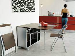 Manufacturers make folding dining tables of many different materials like plastic, metals, wood, bamboo and glass. Furniture Modern Portable Folding Dining Table With Wheels And Folding Chair Storage Inside For Savin Folding Dining Table Wall Dining Table Dining Room Small