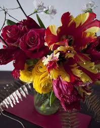 Chinese New Year Inspired Arrangement A Mix Of Quince Red Honeymoon Tulips Red Parrot Tulips Tulips Arrangement Flower Arrangements Chinese New Year Flower