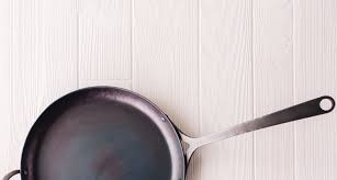 How to clean a carbon steel pan after gooey or burnt food is stuck to the pan. How To Clean And Season Your Carbon Steel Skillet Southern Kitchen