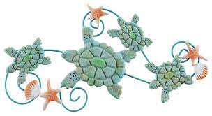 This hand painted sculpture is crafted from metal and features four turtles traveling. Sea Turtles 3d Wall Art With Shells And Starfish By Lavish Home Beach Style Metal Wall Art By Trademark Global Houzz