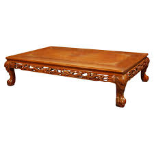 Crafted from solid wood in a distressed finish with brass and copper accents, it adds charm to your space while allowing you to prop up your feet or stash away clutter. Japanese Mahogany Hand Carved Coffee Or Opium Table With Silver Inlay For Sale At 1stdibs