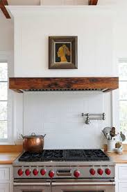 If a modern gas stove lives in your kitchen, it is not recommended to do without a special hood over it: Marie Flanigan Interiors