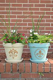 Such a fun way to brighten up your home and outside curb appeal! Flower Pot Painting Idea About A Mom
