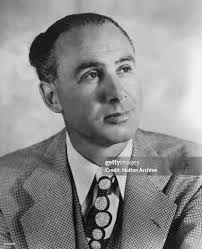 Headshot portrait of American author Irving Stone looking up. News Photo
