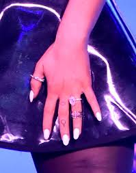It's on the same finger as her venus symbol. A Guide To All Of Ariana Grande And Pete Davidson S Tattoos For One Another