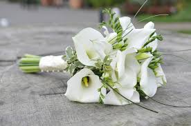 Visit weddingforward.com for more inspiration & florist advice. Calla Lily The Champagne Glass Shaped Flower In Bridal Bouquets Cgtn